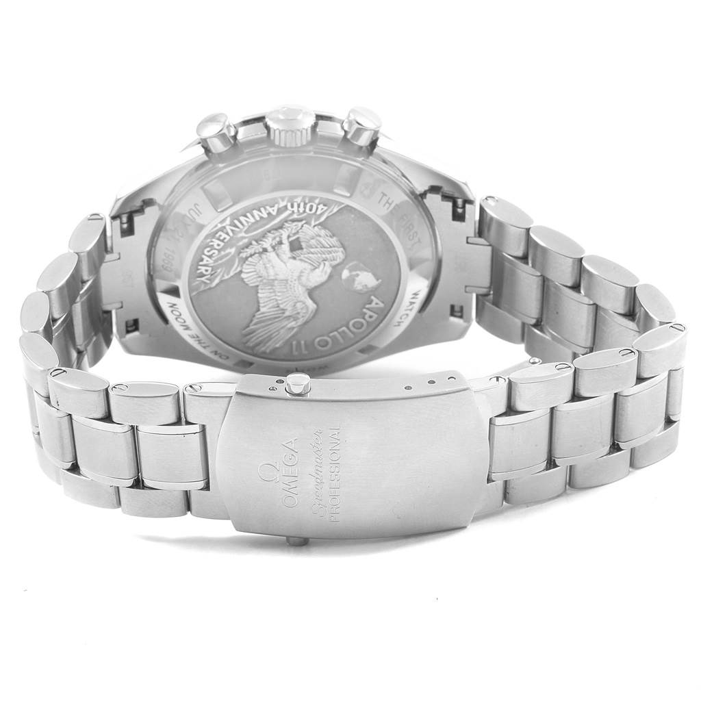 The image shows the back and clasp of an Omega Speedmaster 311.30.42.30.01.002 Men's Stainless Steel Black Dial 311.30.42.30.01.002 Men's Stainless Steel Black Dial watch, highlighting the engraved case back and metal bracelet.