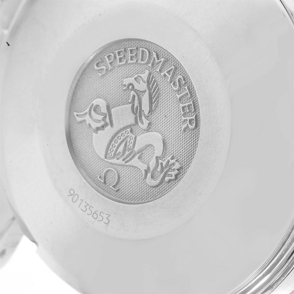 This image shows the back case of an Omega Speedmaster 3513.30.00 Men
s Stainless Steel Silver Dial 3513.30.00 Men
s Stainless Steel Silver Dial watch, highlighting the engraved logo and serial number.