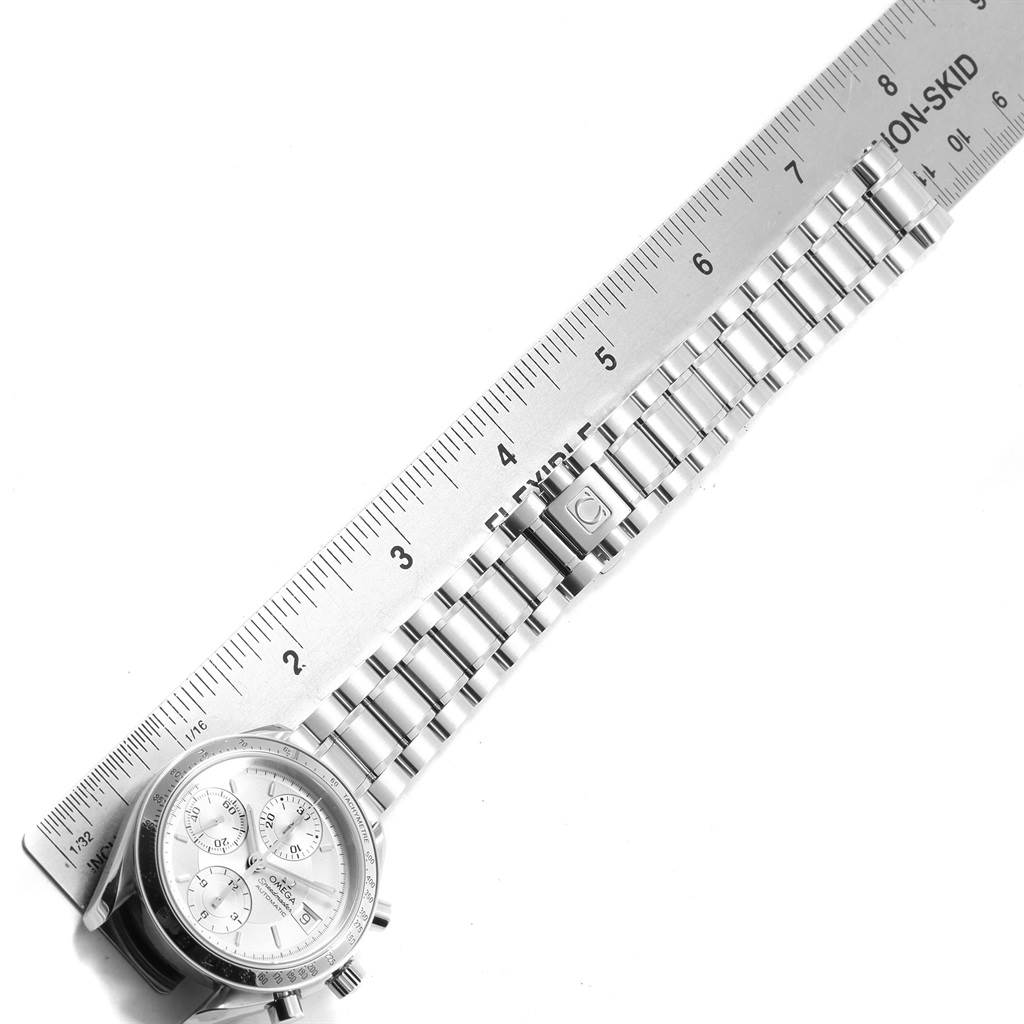 The image shows the Omega Speedmaster 3513.30.00 Men
s Stainless Steel Silver Dial 3513.30.00 Men
s Stainless Steel Silver Dial watch and its bracelet laid next to a ruler for measurement.