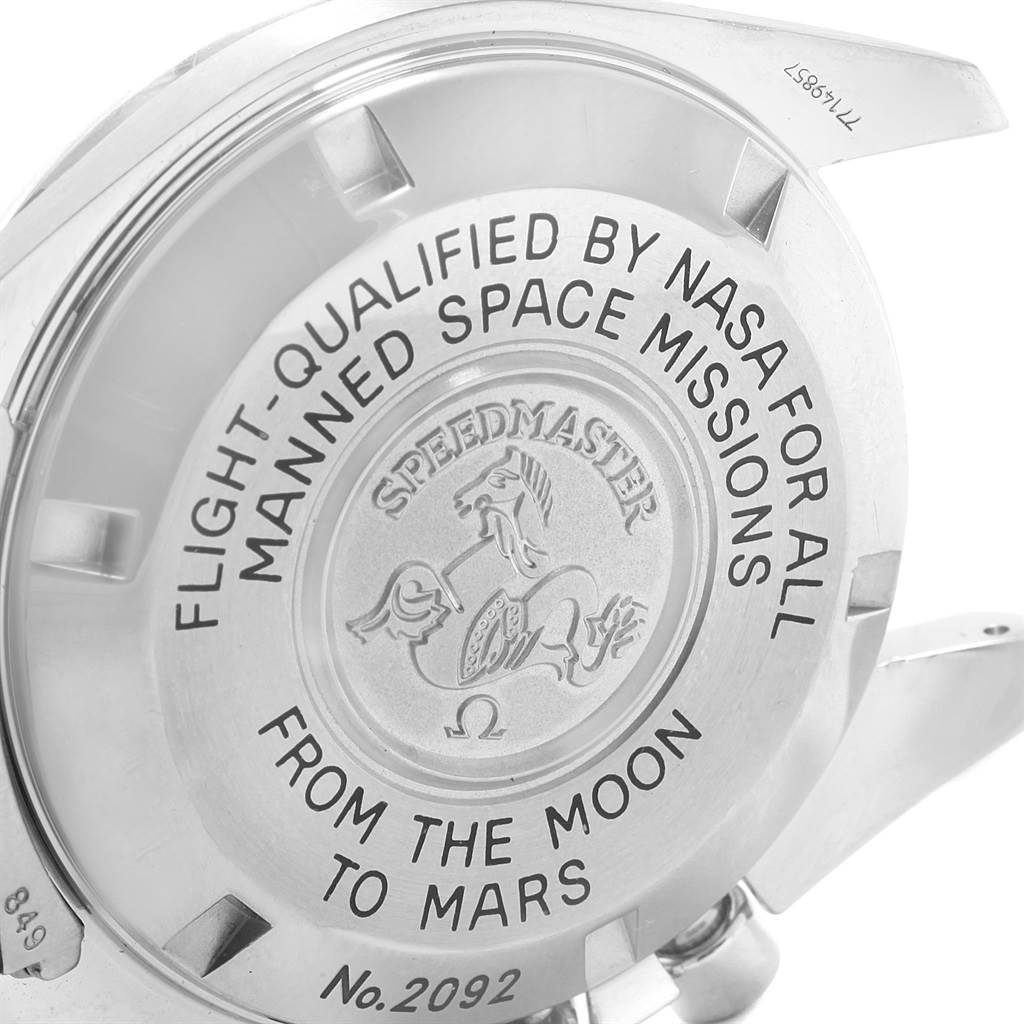 The image shows the engraved case back of an Omega Speedmaster 3577.50.00 Men's Stainless Steel Black Dial 3577.50.00 Men's Stainless Steel Black Dial watch at an angled view.