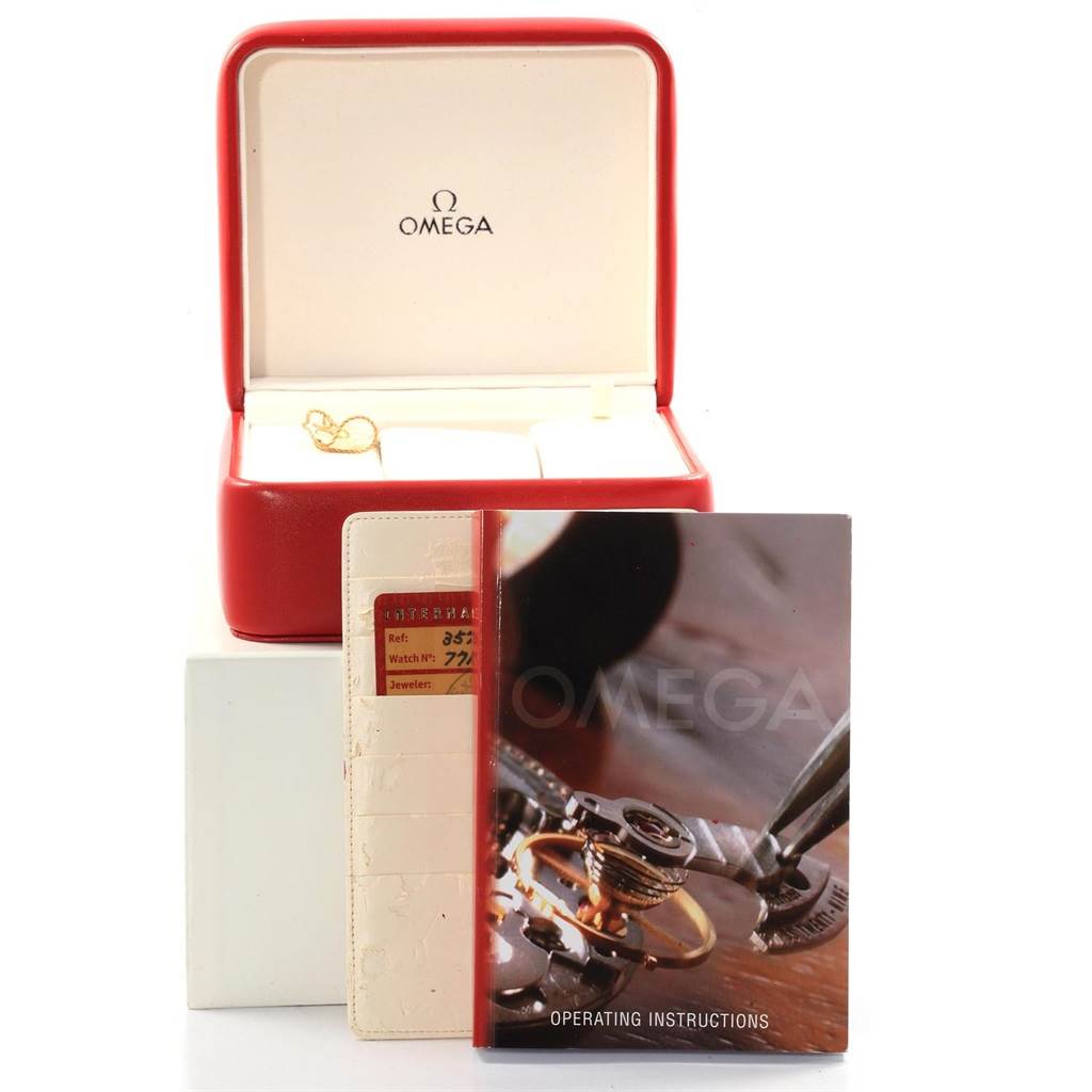 The image shows an Omega Speedmaster 3570.50.00 Men
s Stainless Steel Black Dial 3570.50.00 Men
s Stainless Steel Black Dial watch box, operating instructions, and warranty card displayed at an angle.