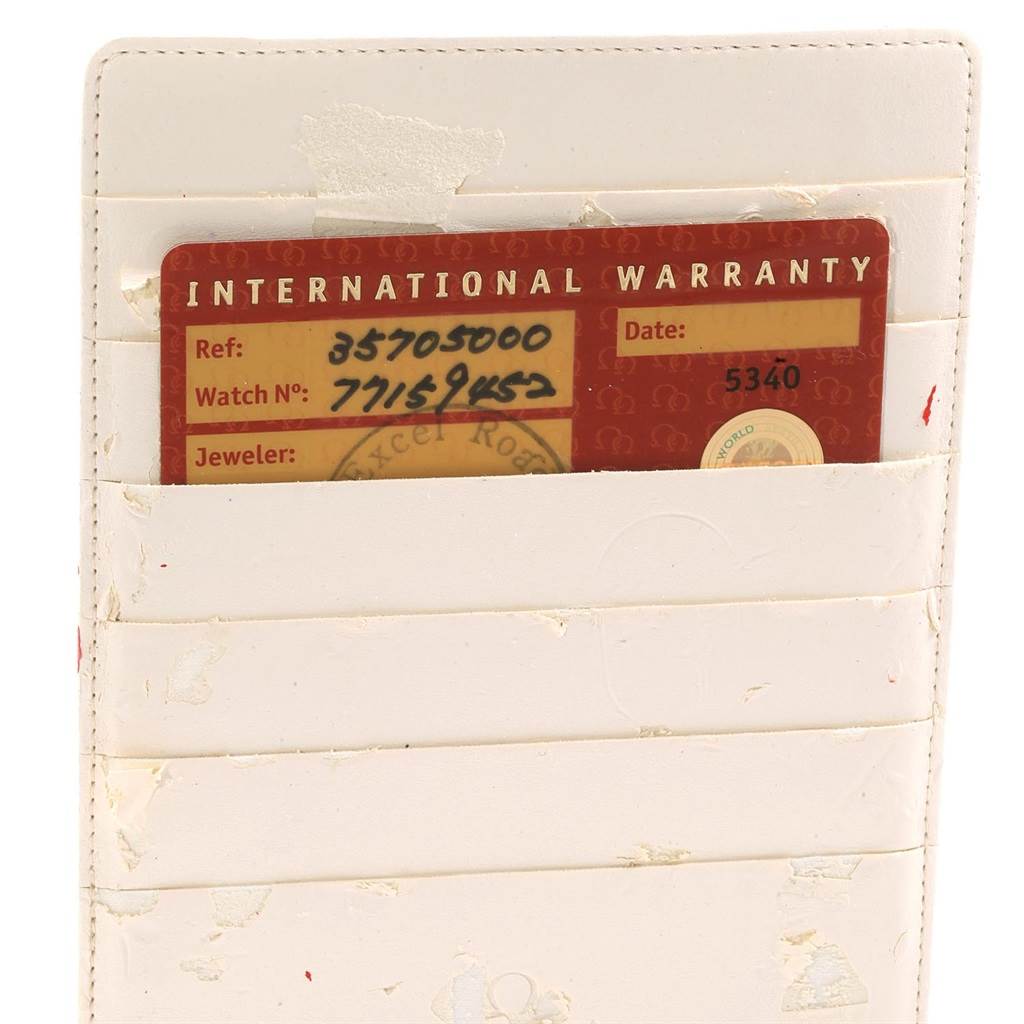 This image shows the International Warranty card for the Omega Speedmaster 3570.50.00 Men
s Stainless Steel Black Dial 3570.50.00 Men
s Stainless Steel Black Dial model, placed in a white cardholder.
