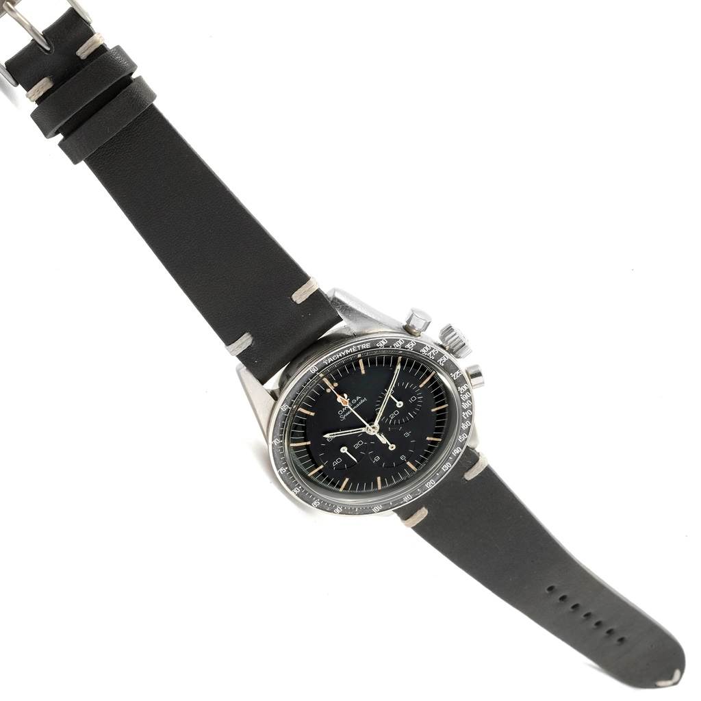 The Omega Speedmaster 105.003-65 Men's Stainless Steel Black Dial 105.003-65 Men's Stainless Steel Black Dial watch is shown at a slight angle, displaying the face, bezel, crown, and black leather strap.