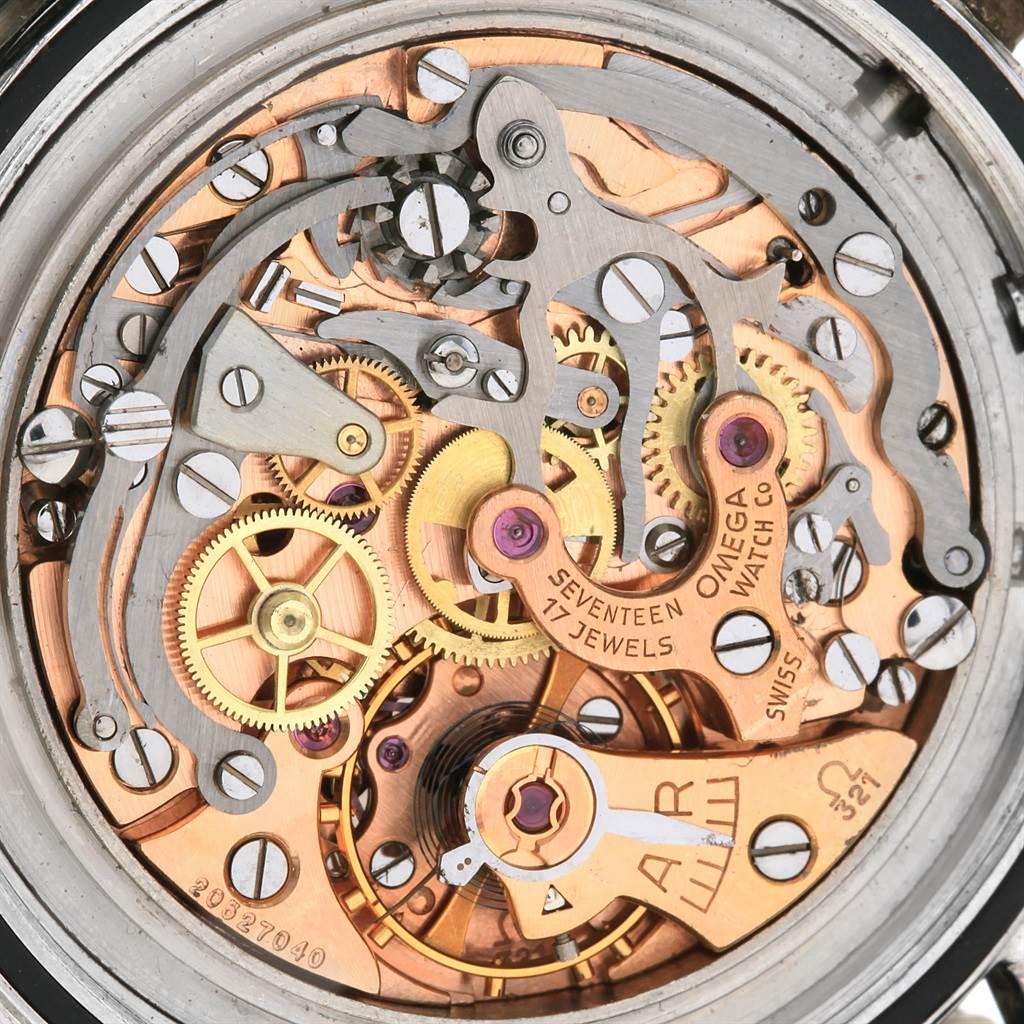 The image shows the intricate internal mechanics and movements of an Omega Speedmaster 105.003-64 Men
s Stainless Steel Black Dial 105.003-64 Men
s Stainless Steel Black Dial watch from a close-up angle.