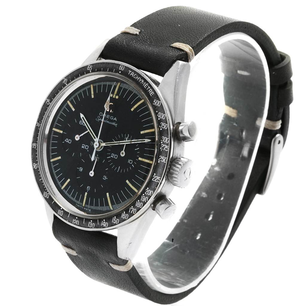 The Omega Speedmaster 105.003-64 Men
s Stainless Steel Black Dial 105.003-64 Men
s Stainless Steel Black Dial watch is shown at an angle displaying the face, bezel, crown, pushers, and leather strap.