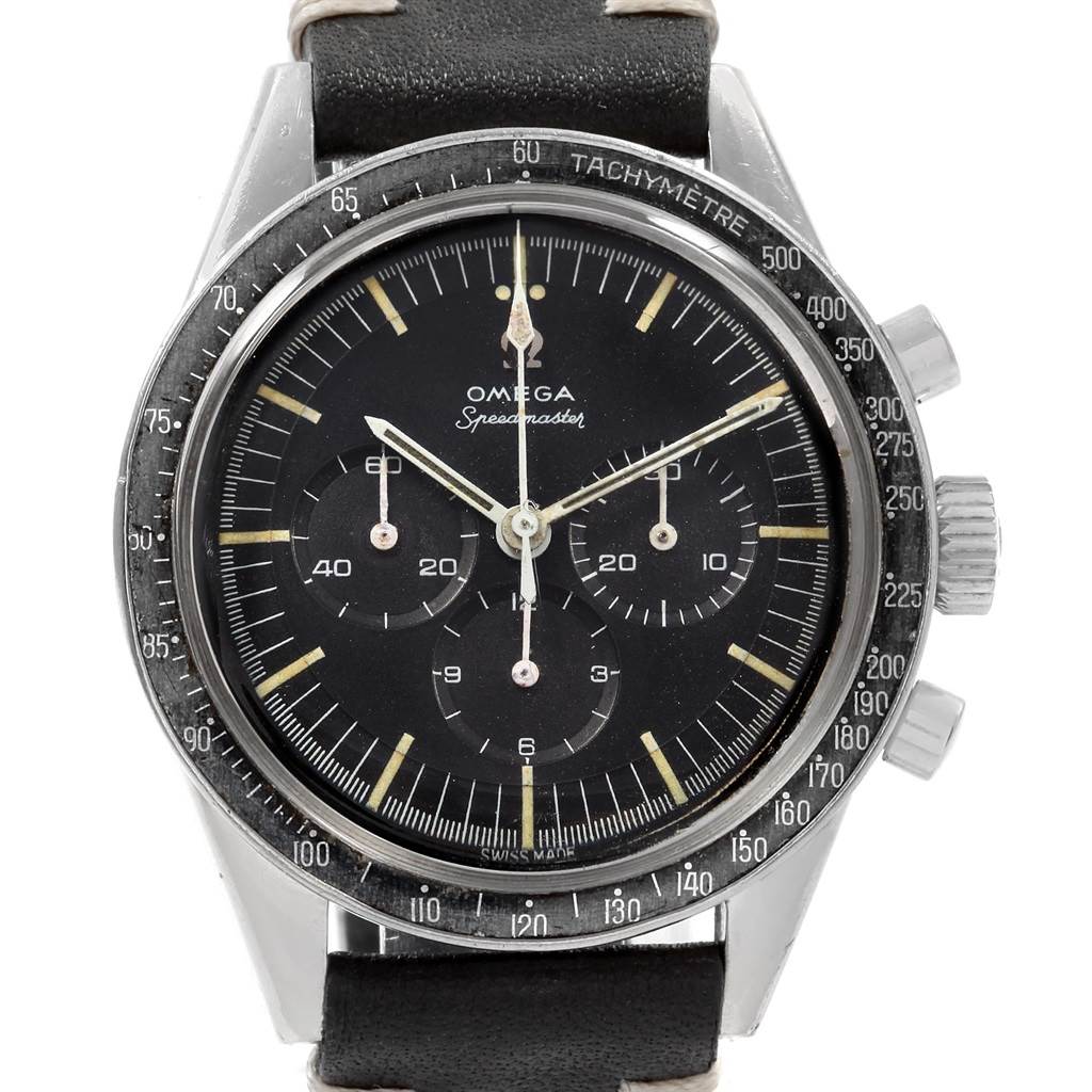The image shows a front view of an Omega Speedmaster 105.003-64 Men
s Stainless Steel Black Dial 105.003-64 Men
s Stainless Steel Black Dial watch, detailing its black dial, tachymetre bezel, and chronograph subdials.