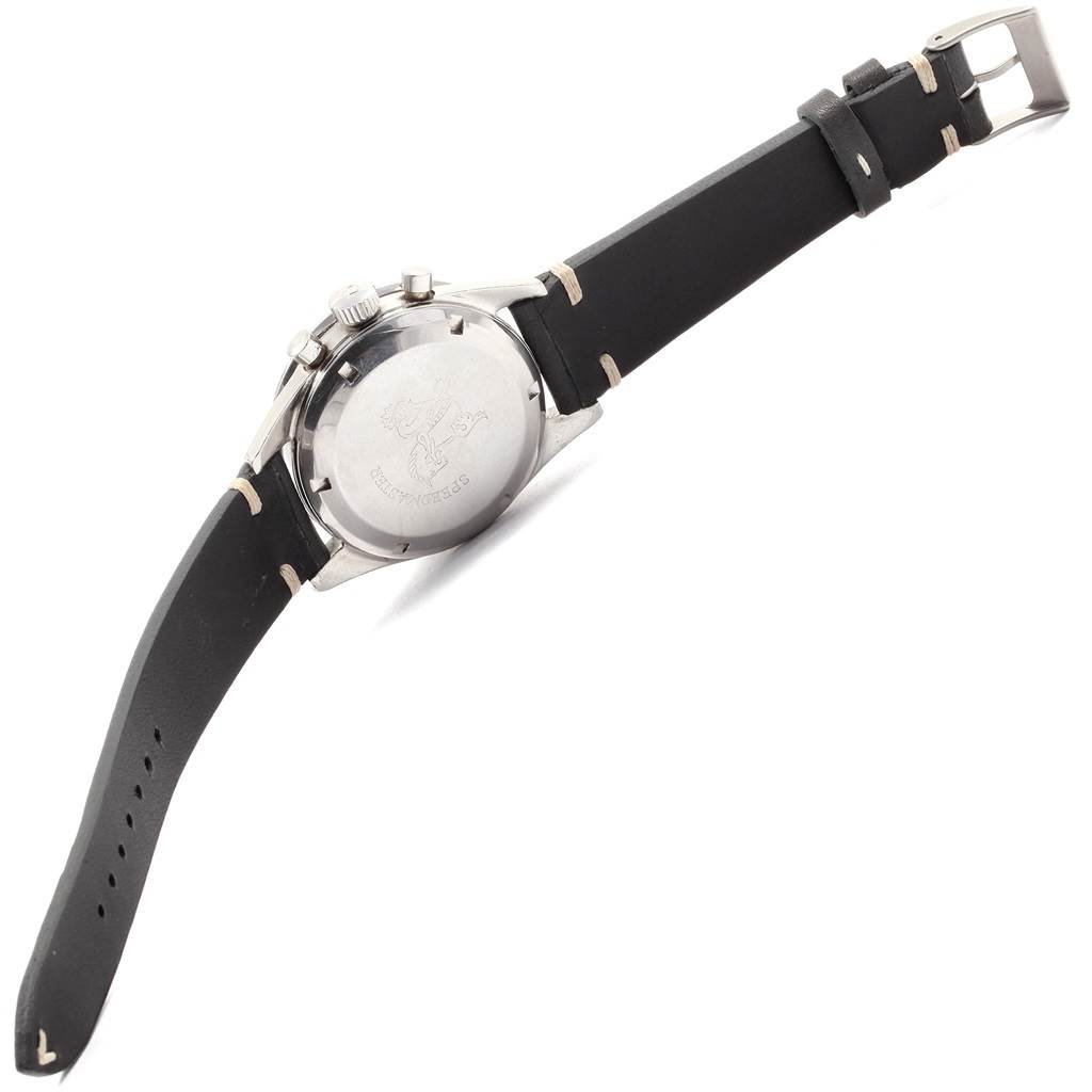 The Omega Speedmaster 105.003-64 Men
s Stainless Steel Black Dial 105.003-64 Men
s Stainless Steel Black Dial watch is shown from the rear angle, highlighting the case back, lugs, and leather strap.