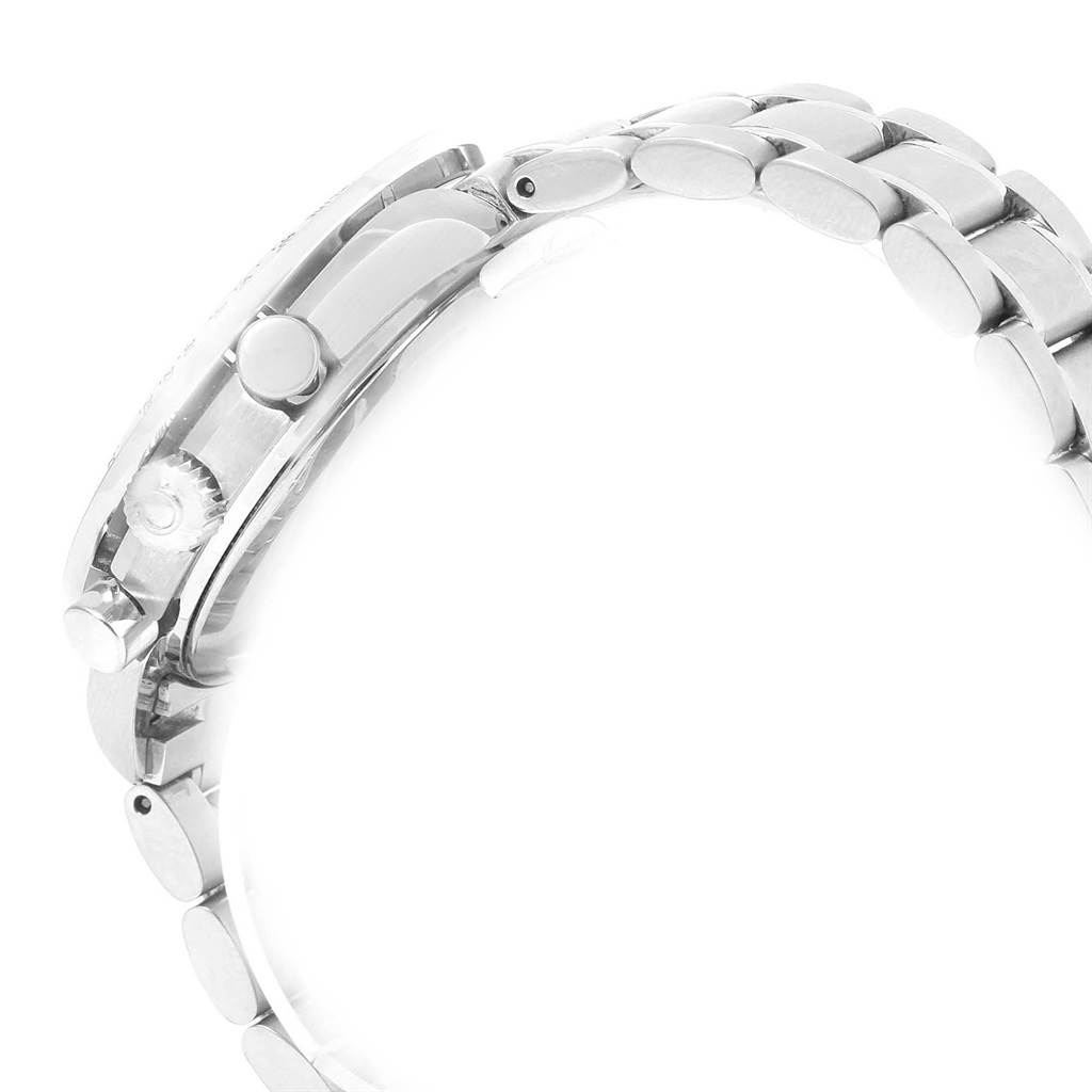 This side view of the Omega Speedmaster 3513.50.00 Men
s Stainless Steel Black Dial 3513.50.00 Men
s Stainless Steel Black Dial watch shows part of the case, crown, pushers, and part of the metal bracelet.