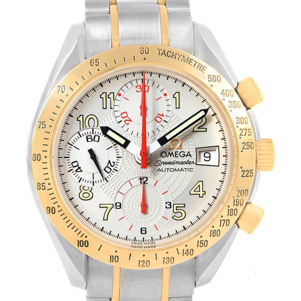 The image shows a frontal view of an Omega Speedmaster 3313.33.00 Men's Steel and Gold (two tone) White Dial 3313.33.00 Men's Steel and Gold (two tone) White Dial watch face and partial band, highlighting subdials, a date window, and a tachymeter bezel.