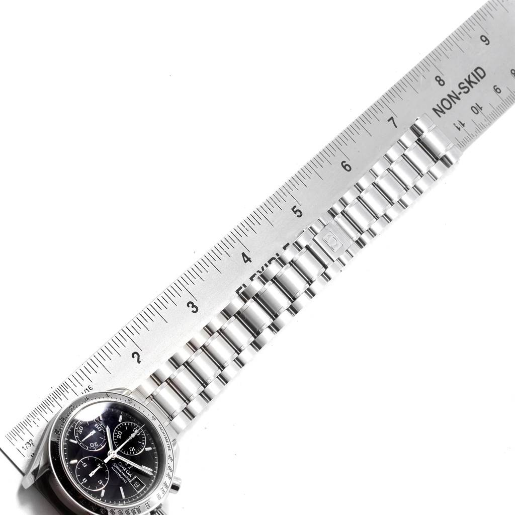 The image shows the Omega Speedmaster 3513.50.00 Men
s Stainless Steel Black Dial 3513.50.00 Men
s Stainless Steel Black Dial watch partially, with a focus on its bracelet measured alongside a ruler.