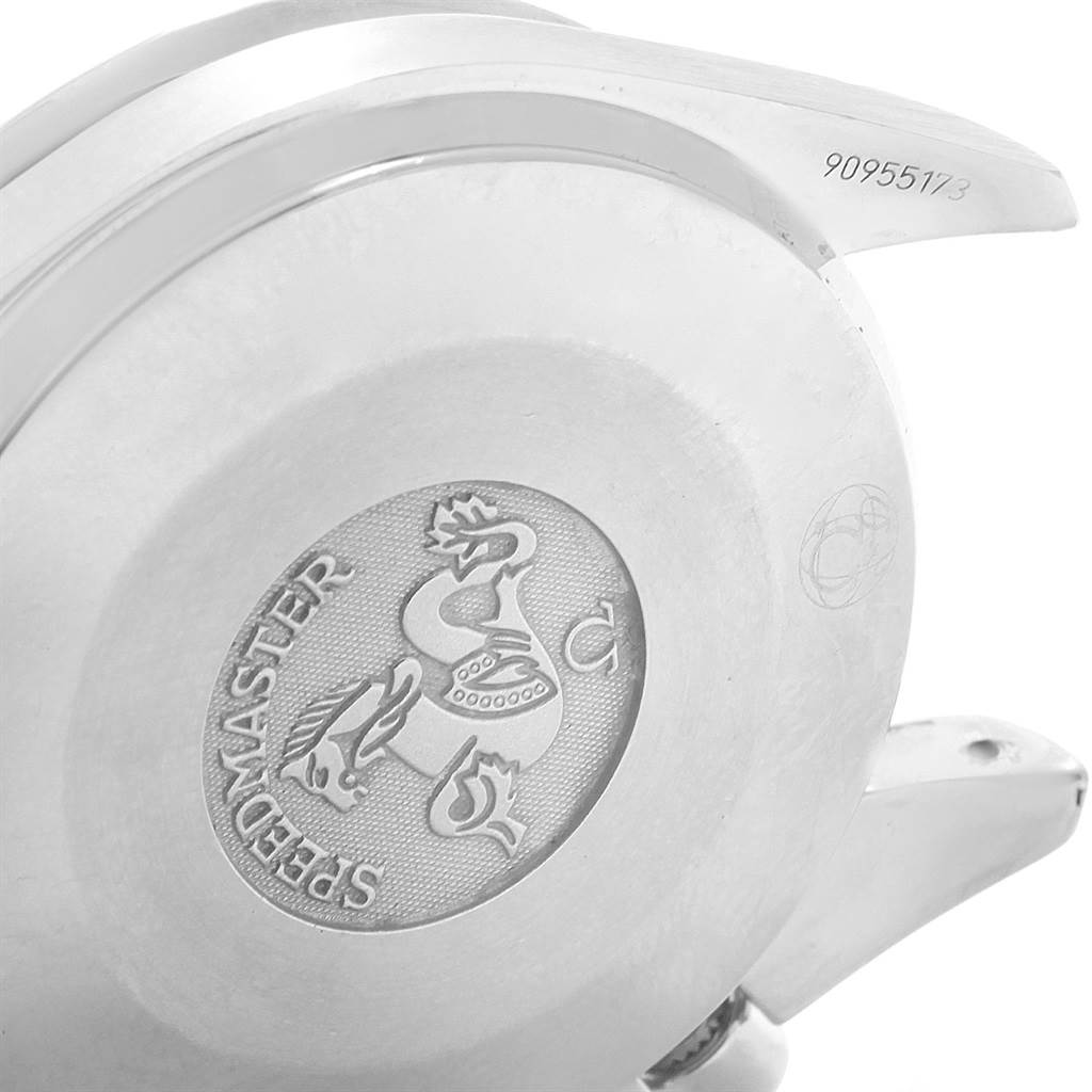 The image shows a close-up of the case back of an Omega Speedmaster 3539.50.00 Men
s Stainless Steel Black Dial 3539.50.00 Men
s Stainless Steel Black Dial watch, including the emblem and some engraving.