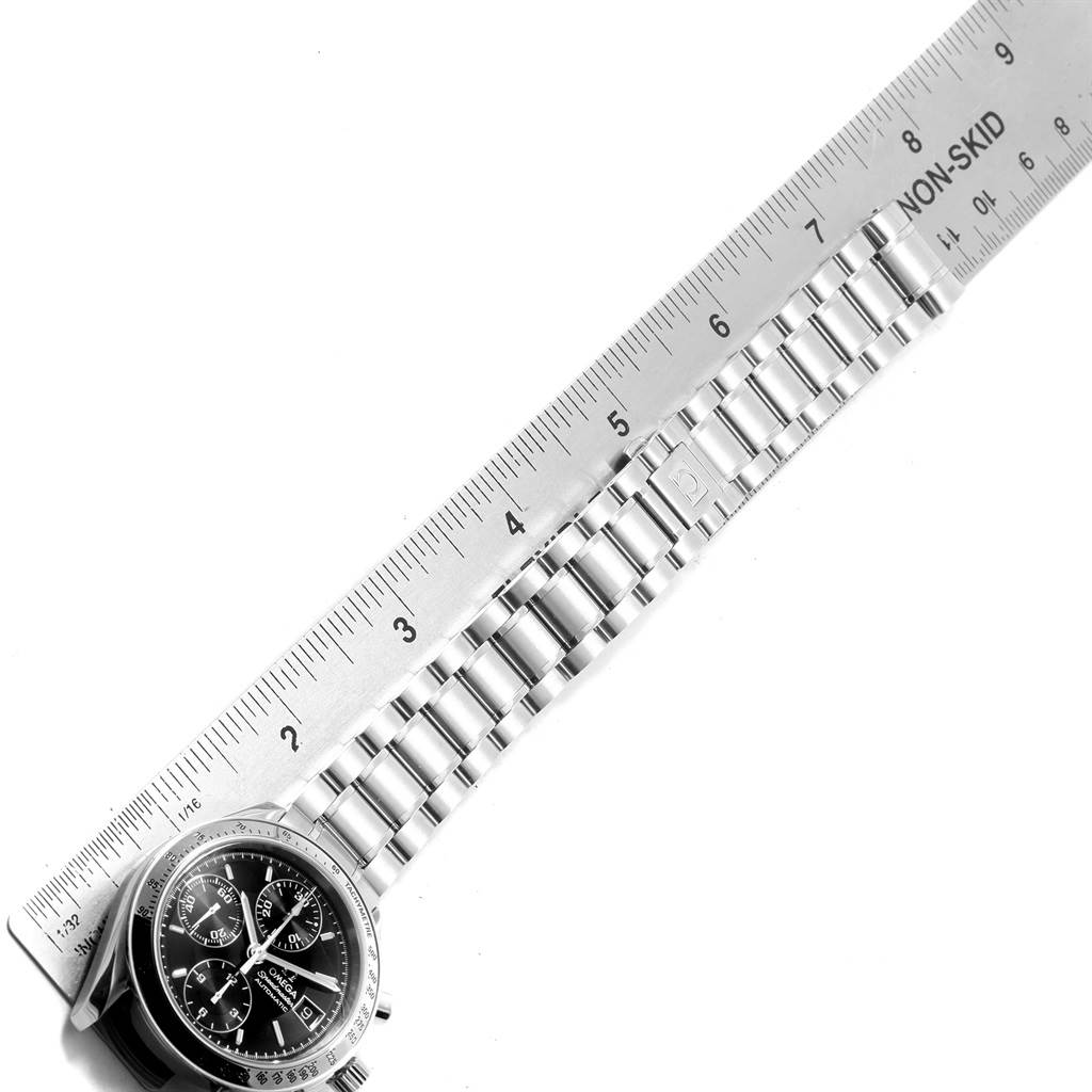 This image shows the face and steel bracelet of an Omega Speedmaster 3513.50.00 Men
s Stainless Steel Black Dial 3513.50.00 Men
s Stainless Steel Black Dial watch, placed alongside a ruler for measurement.