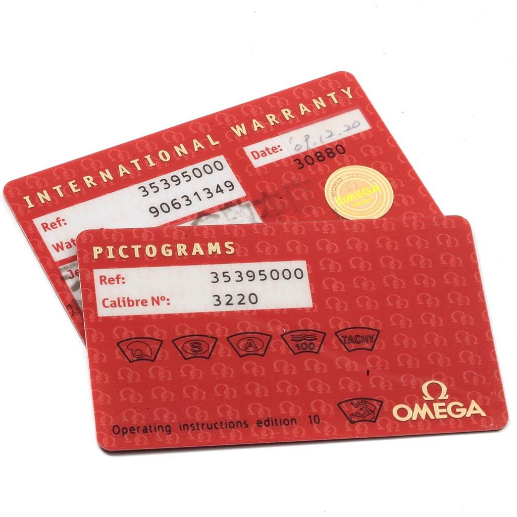 The image shows two red international warranty and pictogram cards for the Omega Speedmaster 3539.50.00 Men
s Stainless Steel Black Dial 3539.50.00 Men
s Stainless Steel Black Dial watch model.