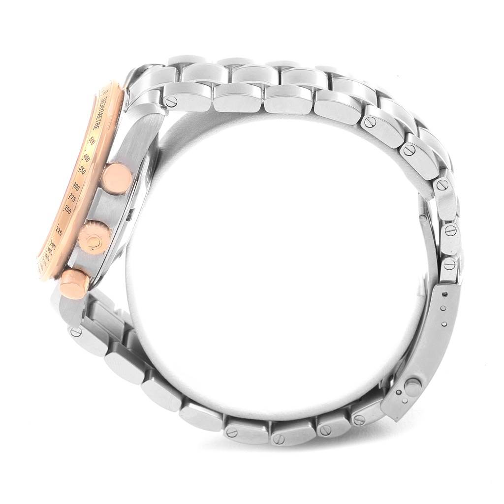 The image shows a side profile of an Omega Speedmaster 323.21.40.40.01.001 Men
s Stainless Steel Black Dial 323.21.40.40.01.001 Men
s Stainless Steel Black Dial watch, highlighting its bezel, chronograph pushers, and metal bracelet.