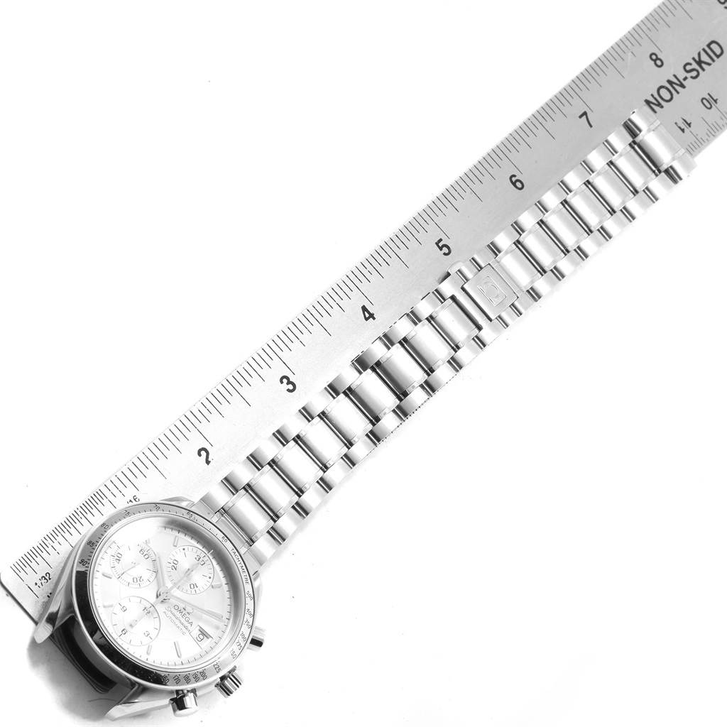 The image shows an Omega Speedmaster 3513.30.00 Men
s Stainless Steel Silver Dial 3513.30.00 Men
s Stainless Steel Silver Dial watch laid next to a ruler, with a clear view of the dial and metal bracelet.