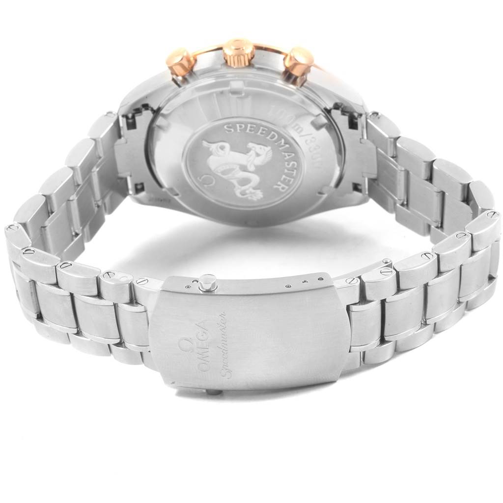 The image shows the back and clasp of the Omega Speedmaster 323.21.40.40.01.001 Men
s Stainless Steel Black Dial 323.21.40.40.01.001 Men
s Stainless Steel Black Dial with a stainless steel bracelet and rose gold crown and pushers.