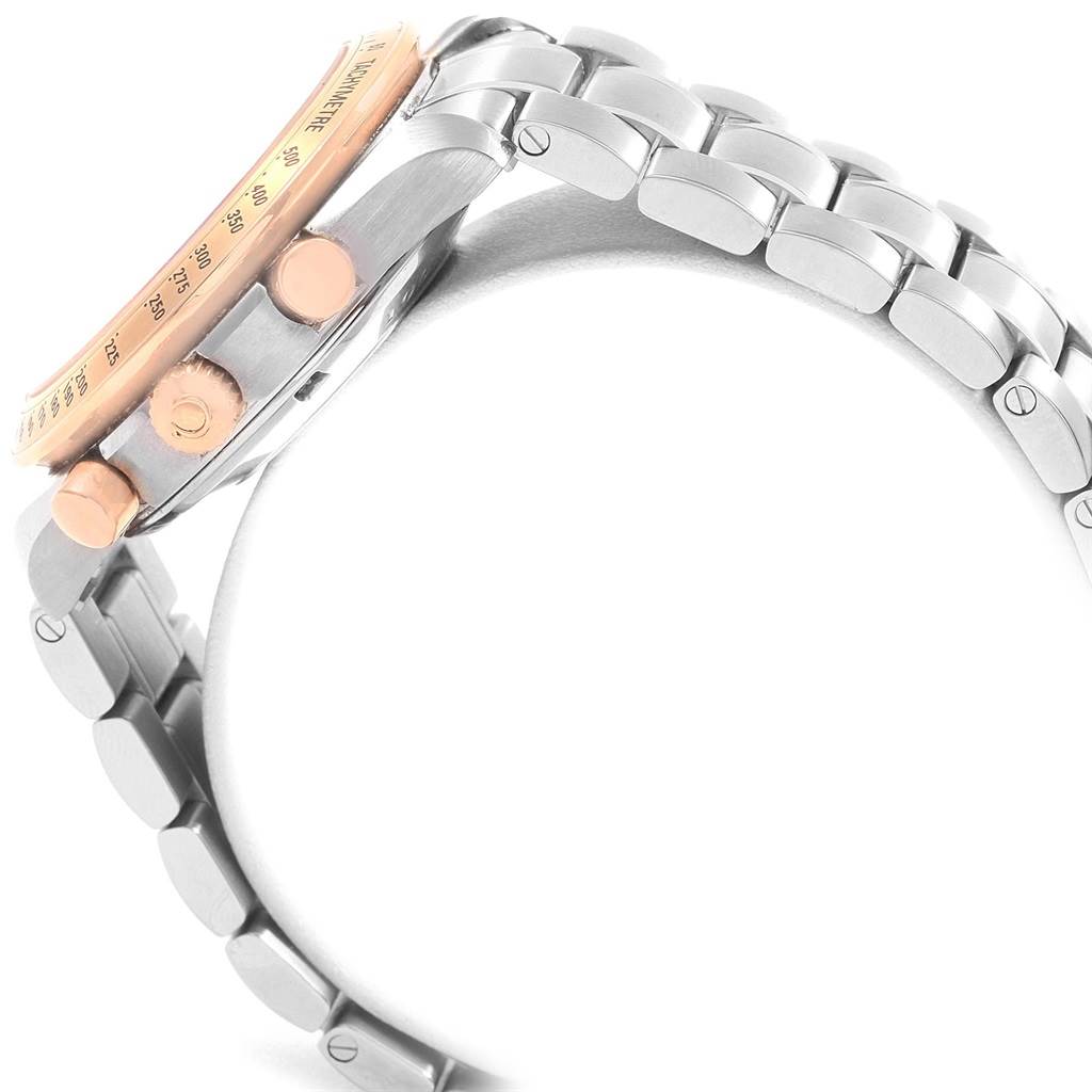 The image shows a side view of the Omega Speedmaster 323.21.40.40.01.001 Men
s Stainless Steel Black Dial 323.21.40.40.01.001 Men
s Stainless Steel Black Dial watch, focusing on the crown, pushers, and a section of the metal bracelet.