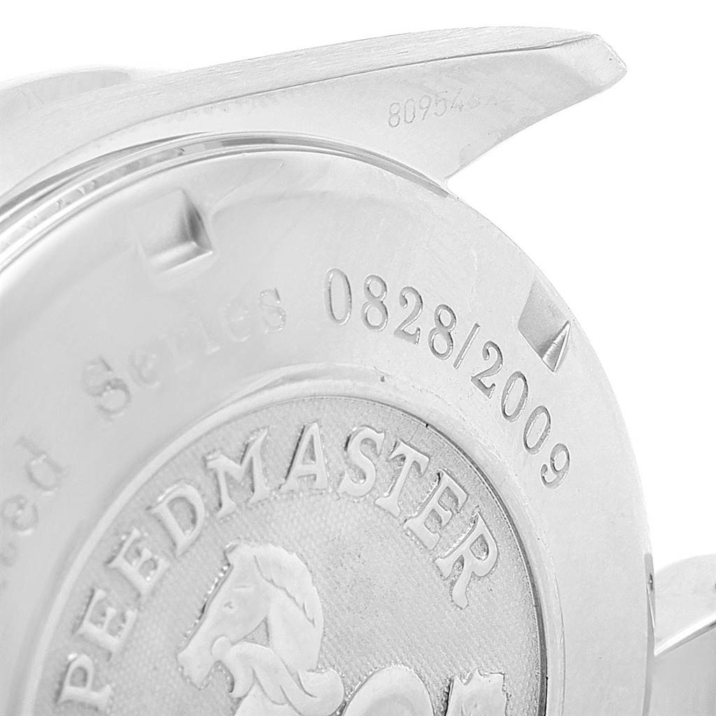 The image shows the back case of an Omega Speedmaster 323.30.40.40.01.001 Men
s Stainless Steel Black Dial 323.30.40.40.01.001 Men
s Stainless Steel Black Dial watch, highlighting the engraved details and part of the lugs.