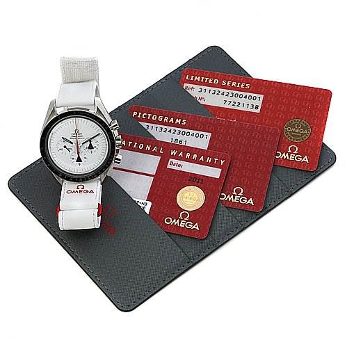 The image shows an Omega Speedmaster 31132423004001 OR 311.   32.   42.   30.   04.   001 Men's Stainless Steel White Dial 31132423004001 OR 311.   32.   42.   30.   04.   001 Men's Stainless Steel White Dial watch with a white strap, warranty cards, and a cardholder, displayed from an overhead angle.