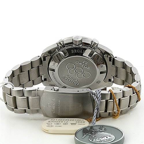 The image shows the back, bracelet, and clasp of the Omega Speedmaster 321.30.44.52.01.001 Men
s Stainless Steel Black Dial 321.30.44.52.01.001 Men
s Stainless Steel Black Dial, with tags highlighting its official timekeeper certification.