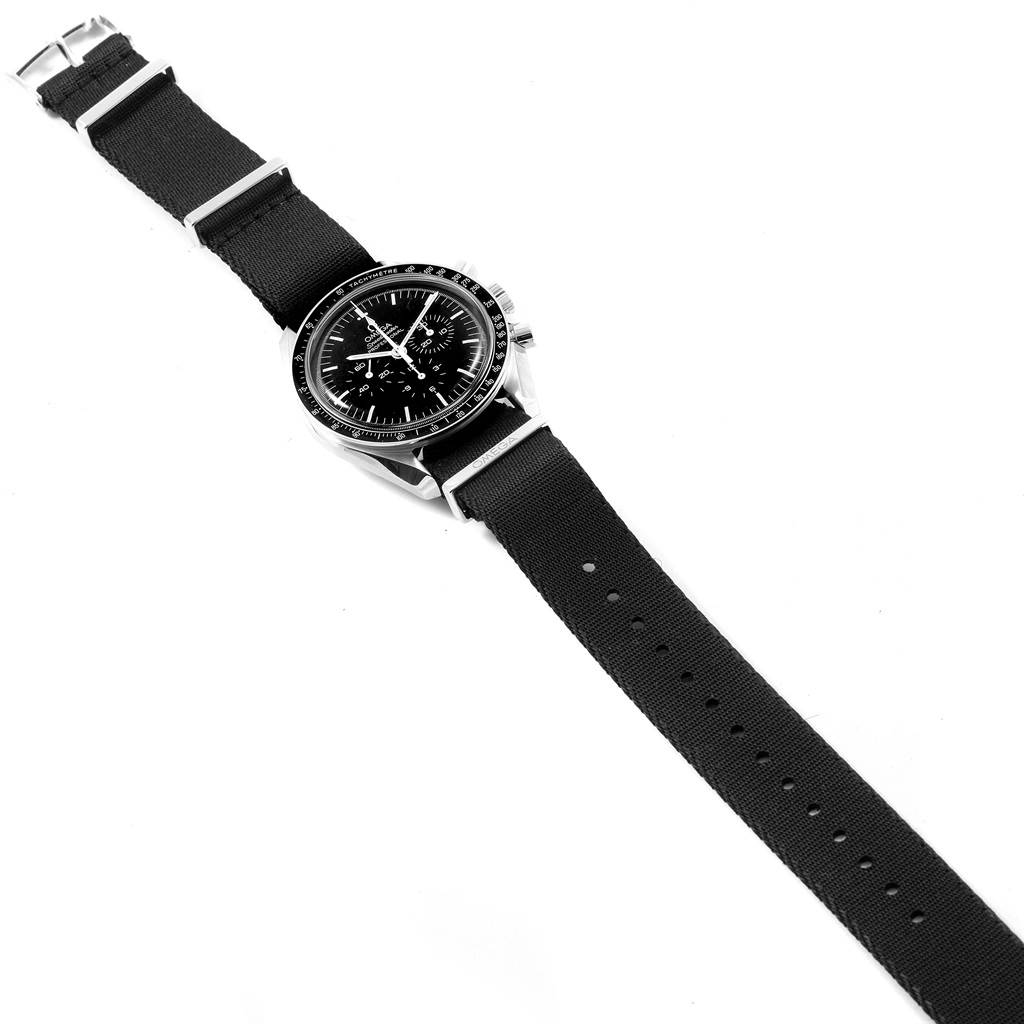 The image shows a full view of an Omega Speedmaster 311.33.42.30.01.001 Men
s Stainless Steel Black Dial 311.33.42.30.01.001 Men
s Stainless Steel Black Dial watch with a black fabric strap, displayed horizontally.