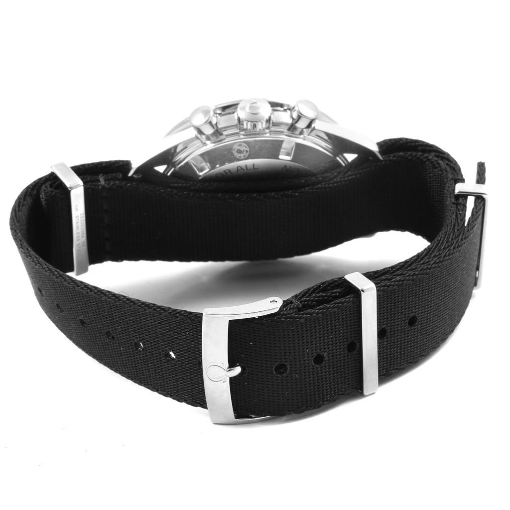The image shows the Omega Speedmaster 311.33.42.30.01.001 Men
s Stainless Steel Black Dial 311.33.42.30.01.001 Men
s Stainless Steel Black Dial watch from the back, highlighting its black fabric strap and clasp.