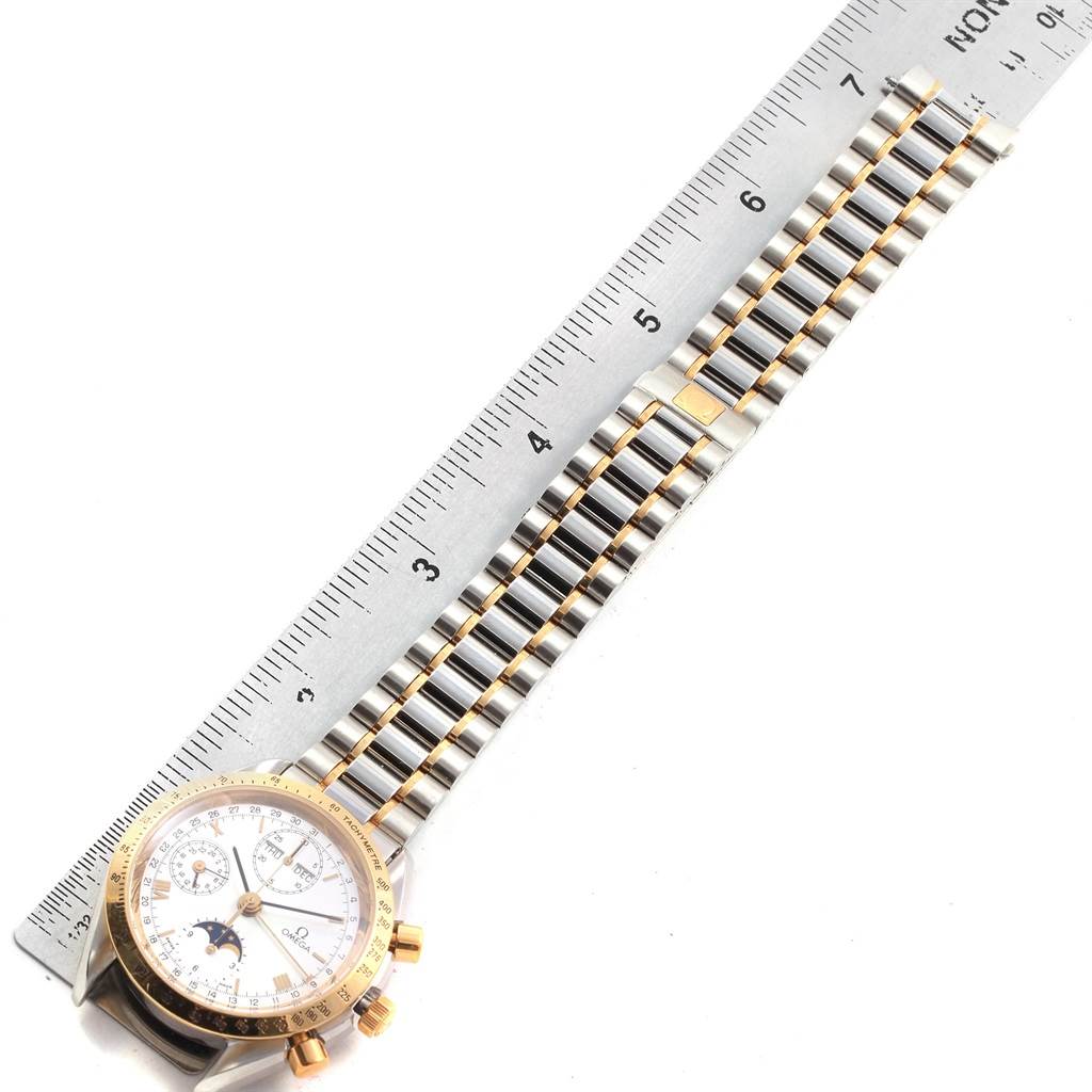 The image shows the Omega Speedmaster 3330.20.00 Men
s Stainless Steel White Dial 3330.20.00 Men
s Stainless Steel White Dial watch at a top-down angle, highlighting the watch face, bezel, and its stainless steel and gold bracelet.