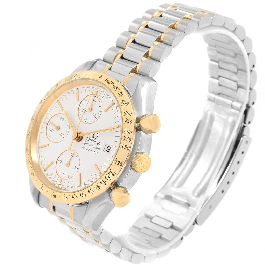 The image shows an Omega Speedmaster 3311.20.00 Men's Steel and Gold (two tone) White Dial 3311.20.00 Men's Steel and Gold (two tone) White Dial watch at an angle highlighting its gold bezel, white dial, chronograph subdials, and two-tone bracelet.