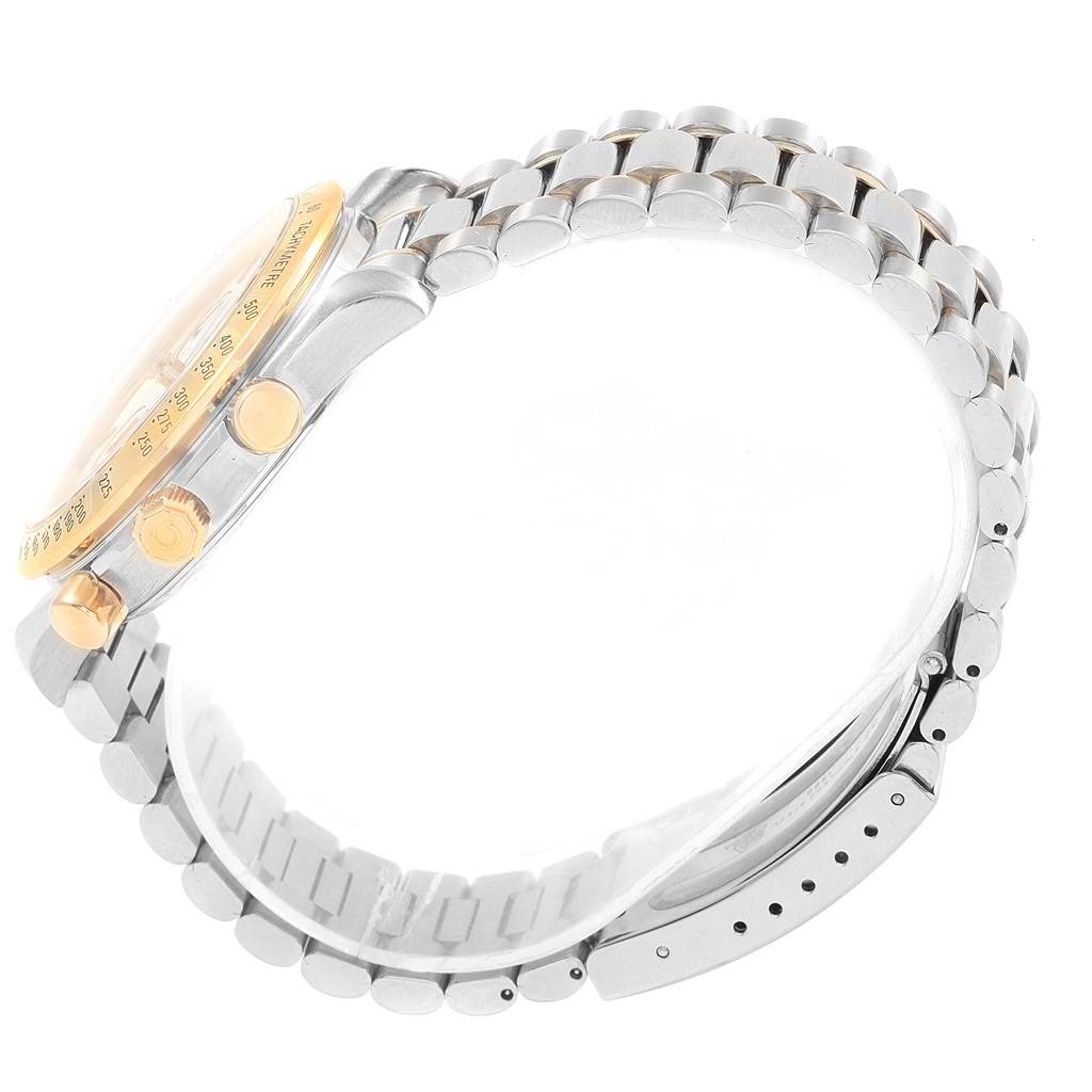 The Omega Speedmaster 3311.20.00 Men's Steel and Gold (two tone) White Dial 3311.20.00 Men's Steel and Gold (two tone) White Dial watch is shown from a side angle, highlighting the case, crown, pushers, and stainless steel bracelet.