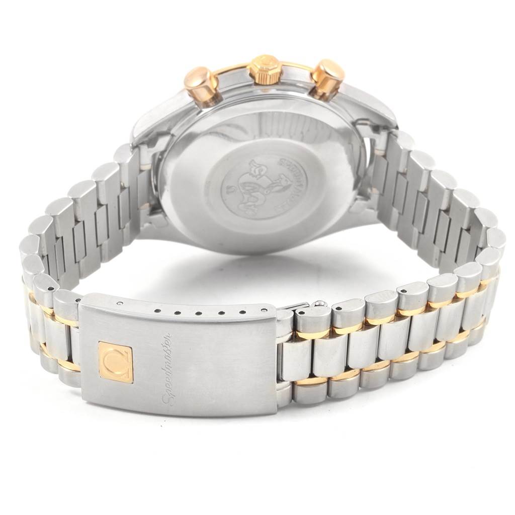 The image shows the back casing and bracelet of an Omega Speedmaster 3311.20.00 Men's Steel and Gold (two tone) White Dial 3311.20.00 Men's Steel and Gold (two tone) White Dial watch with a two-tone metal finish and visible clasp.