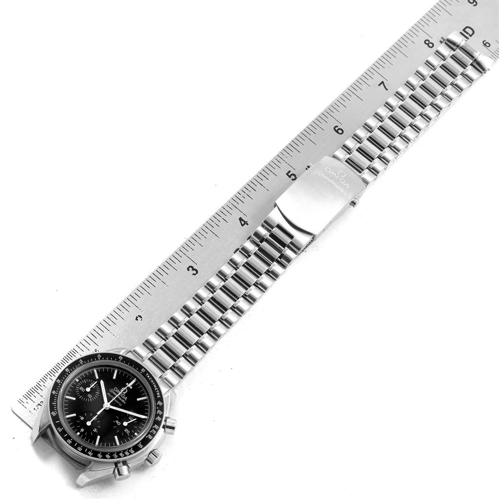 The Omega Speedmaster 3539.50.00 Men
s Stainless Steel Black Dial 3539.50.00 Men
s Stainless Steel Black Dial watch is shown from an overhead view, highlighting its face and full metal bracelet alongside a ruler for scale.
