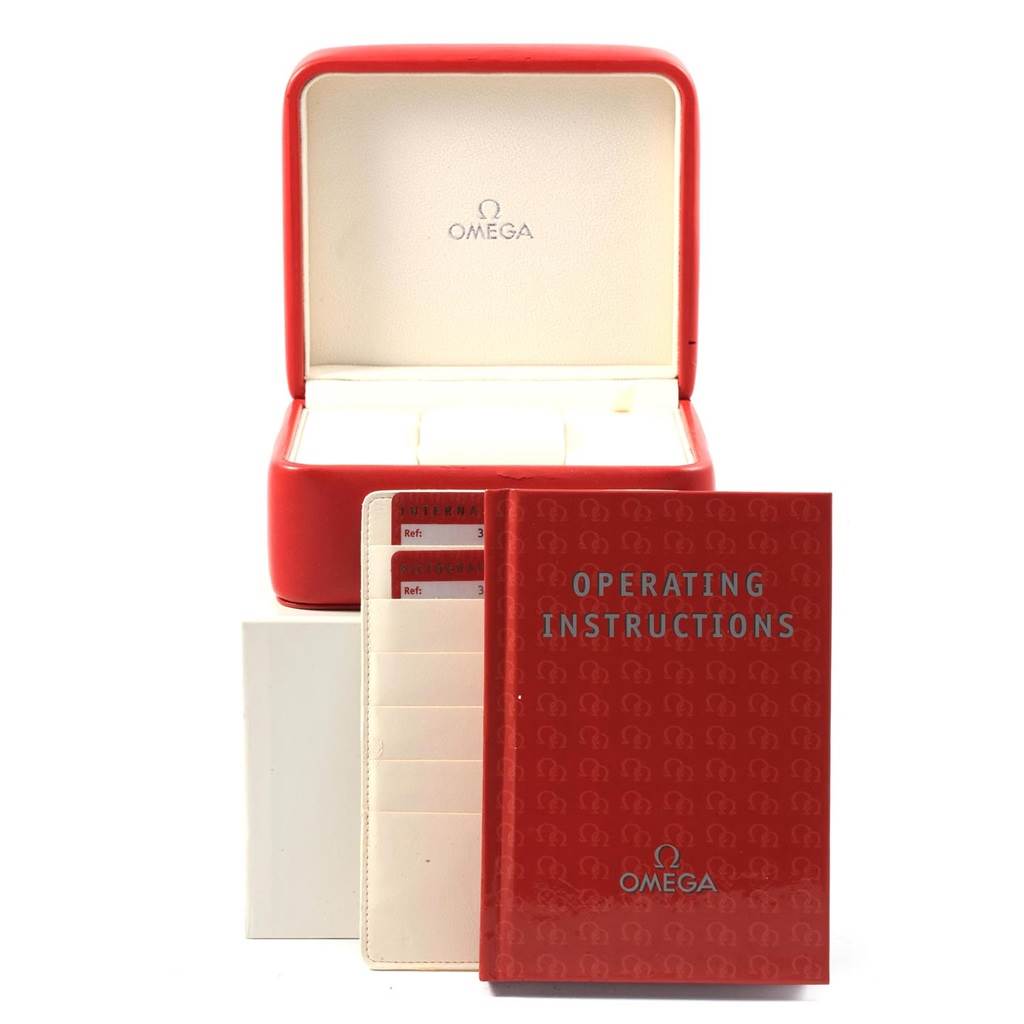 The image shows the Omega Speedmaster 3212.80.00 Men
s Stainless Steel Blue Dial 3212.80.00 Men
s Stainless Steel Blue Dial watch box, operating instructions, and warranty cards.