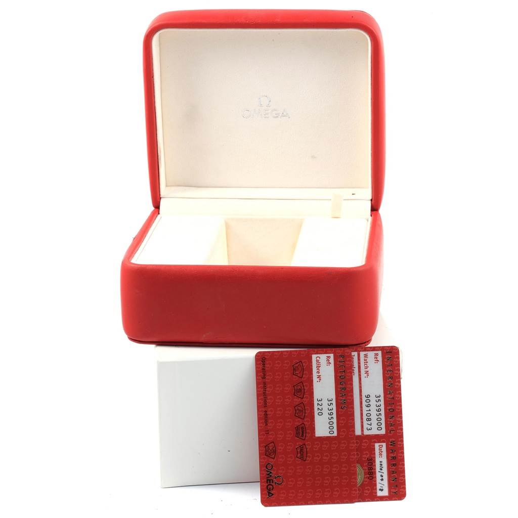 The image shows an open Omega Speedmaster 3539.50.00 Men
s Stainless Steel Black Dial 3539.50.00 Men
s Stainless Steel Black Dial watch box and a warranty card from a front angle.