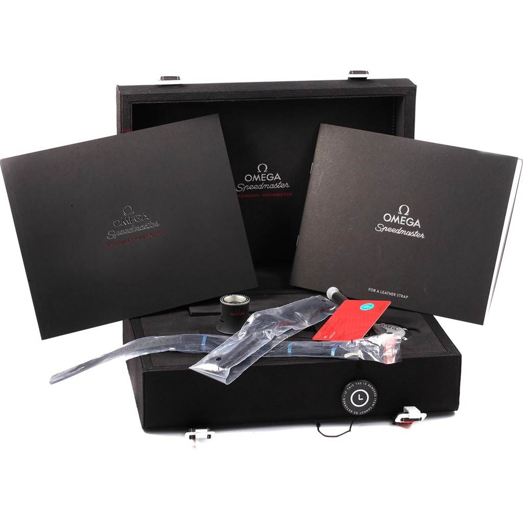 The image shows packaging and accessories for an Omega Speedmaster 311.33.42.30.01.001 Men
s Stainless Steel Black Dial 311.33.42.30.01.001 Men
s Stainless Steel Black Dial watch, including documents, a strap, and a magnifying glass.