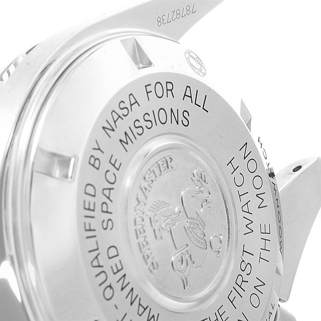 The image shows a close-up of the case back of the Omega Speedmaster 311.33.42.30.01.001 Men
s Stainless Steel Black Dial 311.33.42.30.01.001 Men
s Stainless Steel Black Dial watch, featuring engraved text and emblem.