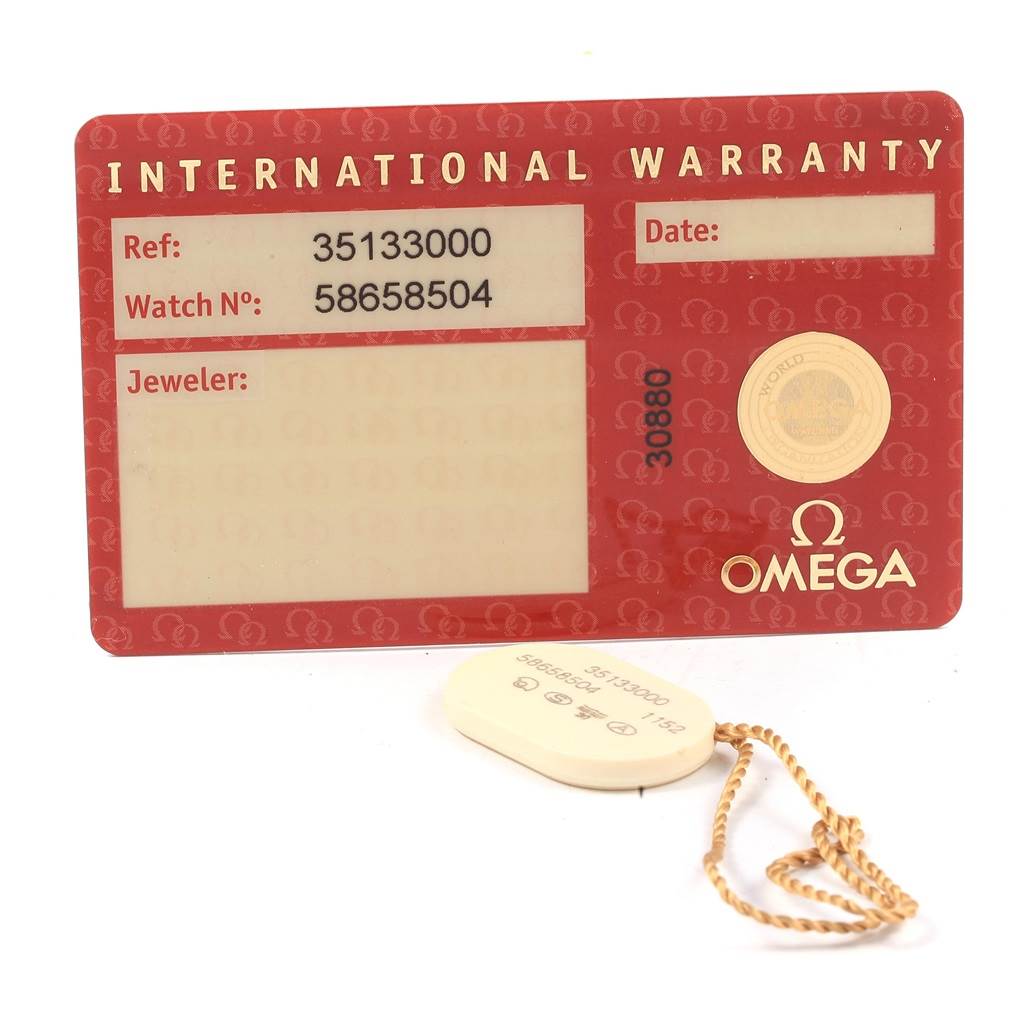 The image shows an Omega Speedmaster 3513.50.00 Men
s Stainless Steel Black Dial 3513.50.00 Men
s Stainless Steel Black Dial
s International Warranty card and a hangtag with a reference number.