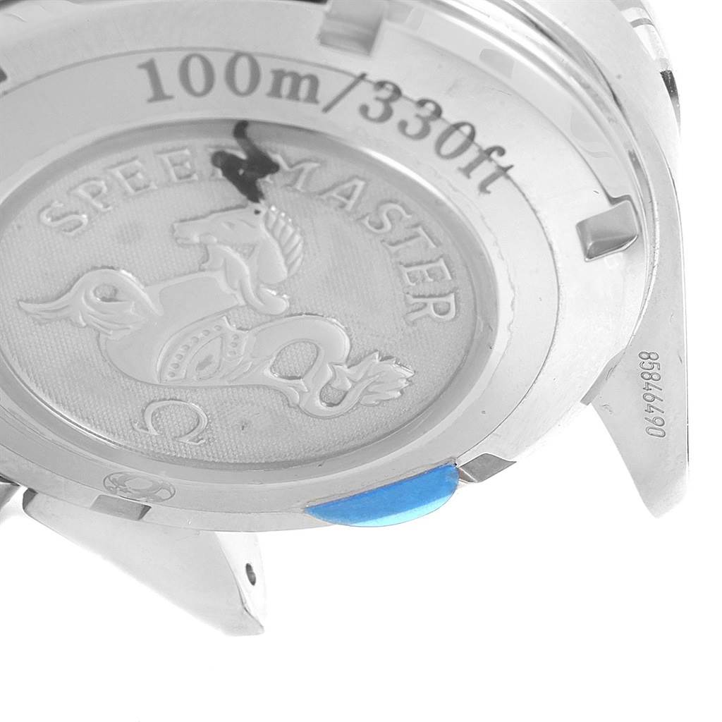 The image shows the back of an Omega Speedmaster 323.30.40.40.06.001 Men's Stainless Steel Grey Dial 323.30.40.40.06.001 Men's Stainless Steel Grey Dial watch at an angle, highlighting its engraved case back and water resistance rating.