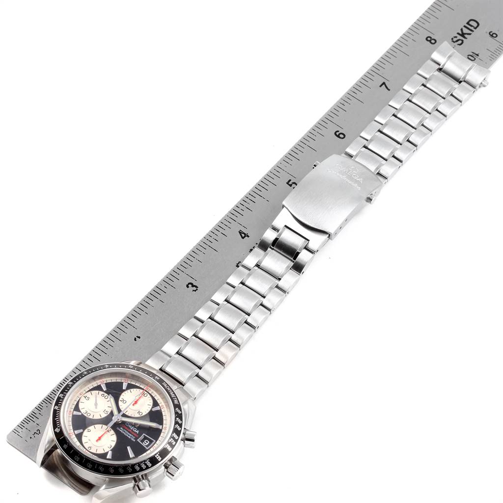 The image shows an Omega Speedmaster 3210.51.00 Men's Stainless Steel Black Dial 3210.51.00 Men's Stainless Steel Black Dial watch laid flat with its band measured against a ruler.