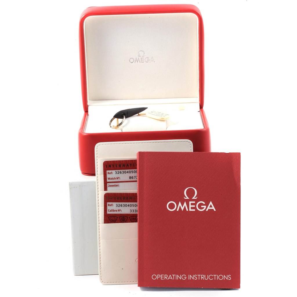 The image displays an Omega Speedmaster 326.30.40.50.01.001 Men
s Stainless Steel Black Dial 326.30.40.50.01.001 Men
s Stainless Steel Black Dial
s red presentation box, warranty card, and operating instructions.