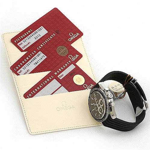 The image shows an Omega Speedmaster 321.32.44.50.01.001 Men
s Stainless Steel Black Dial 321.32.44.50.01.001 Men
s Stainless Steel Black Dial watch at an angled side view alongside its warranty, pictogram, and chronometer certificate cards.