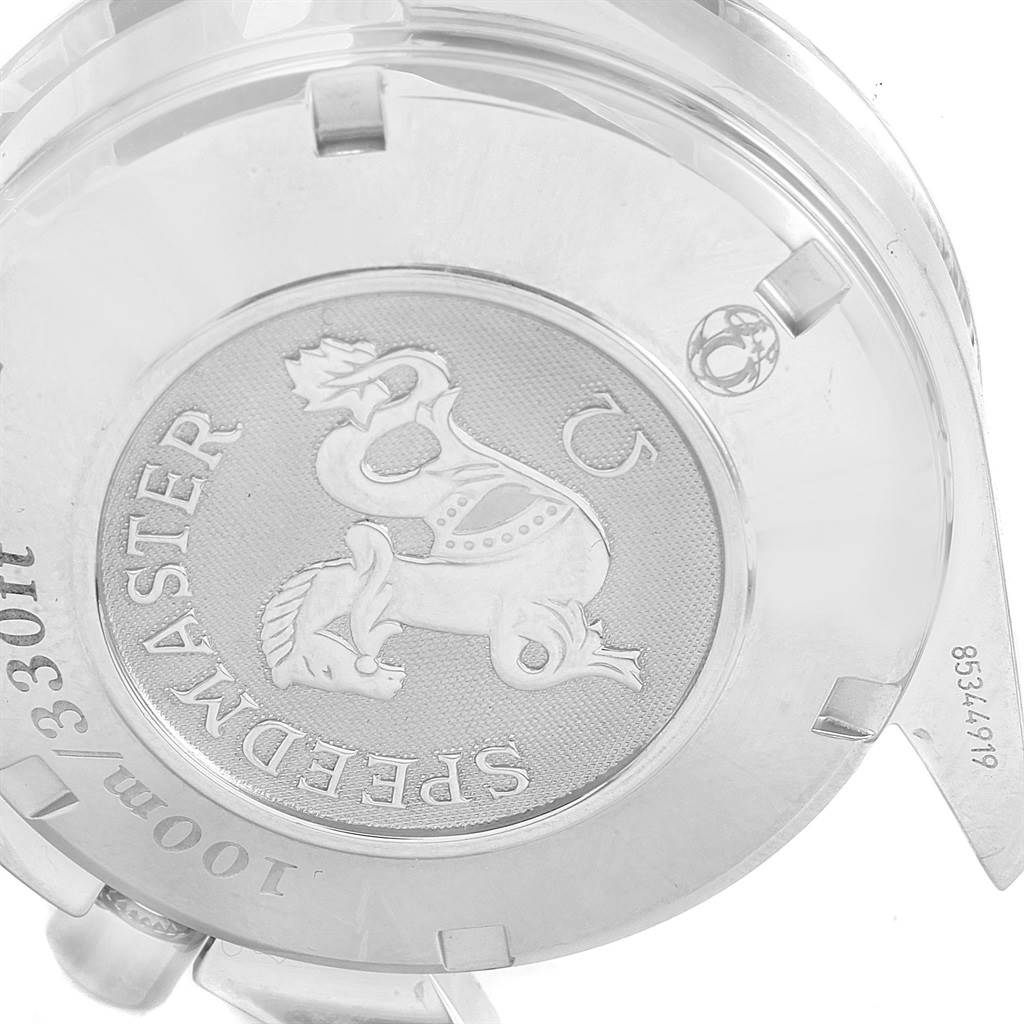 This close-up image shows the case back of the Omega Speedmaster 3211.30.00 Men's Stainless Steel Silver Dial 3211.30.00 Men's Stainless Steel Silver Dial watch featuring the model's emblem and inscriptions.