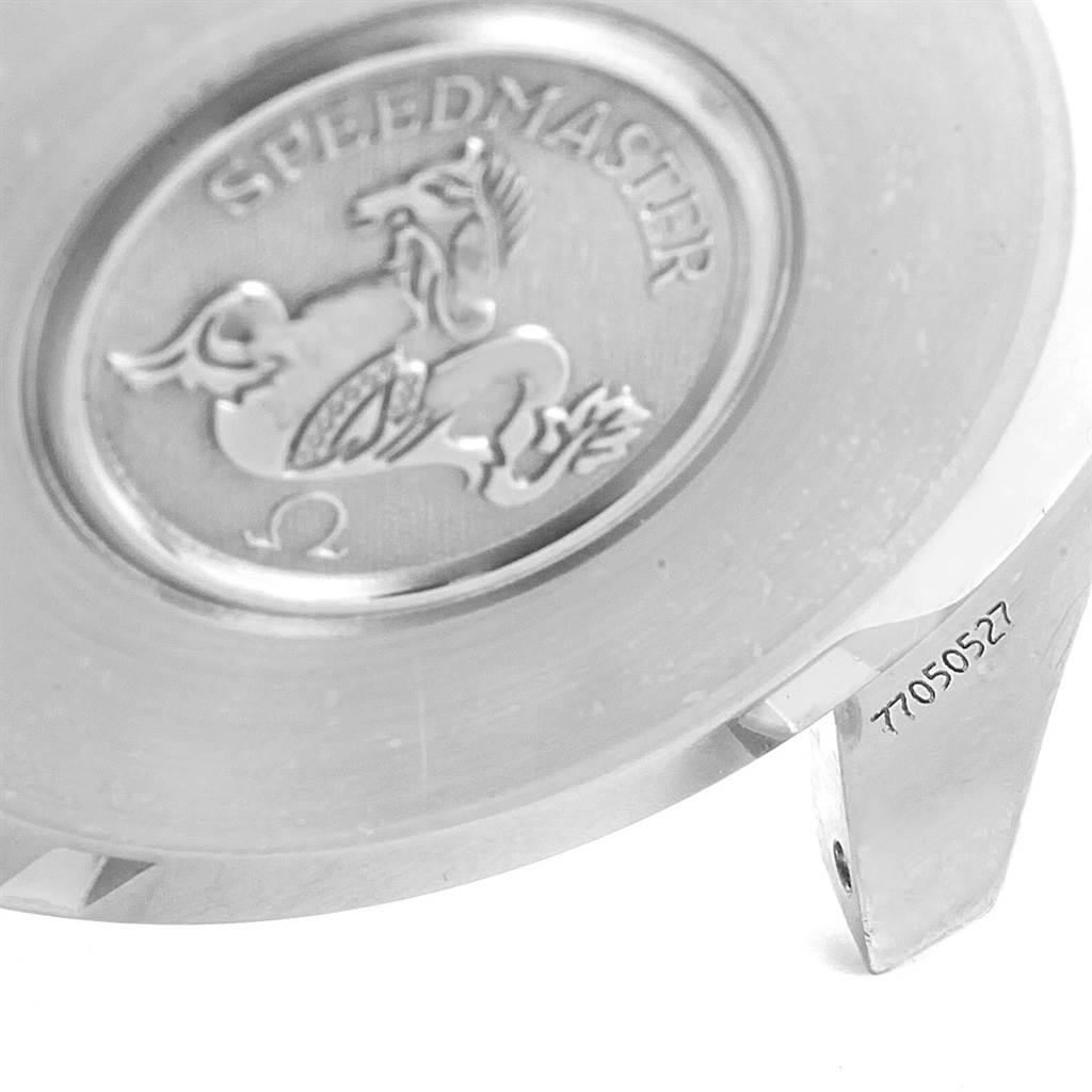 The image shows a close-up of the Omega Speedmaster 3594.50.00 Men
s Stainless Steel Black Dial 3594.50.00 Men
s Stainless Steel Black Dial
s case back, featuring an engraved logo and partial serial number.