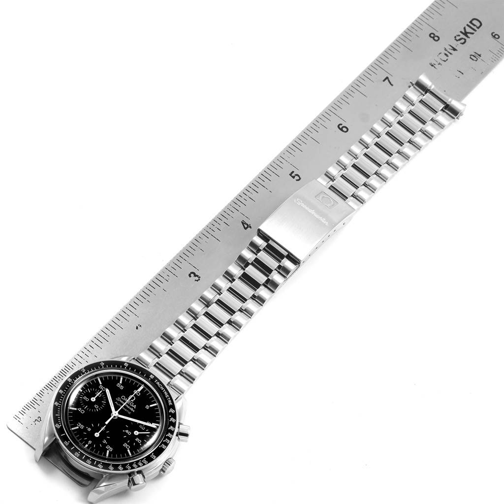 The Omega Speedmaster 3510.50.00 Men
s Stainless Steel Black Dial 3510.50.00 Men
s Stainless Steel Black Dial watch is shown diagonally with its face, bracelet, and clasp visible, alongside a ruler for scale.