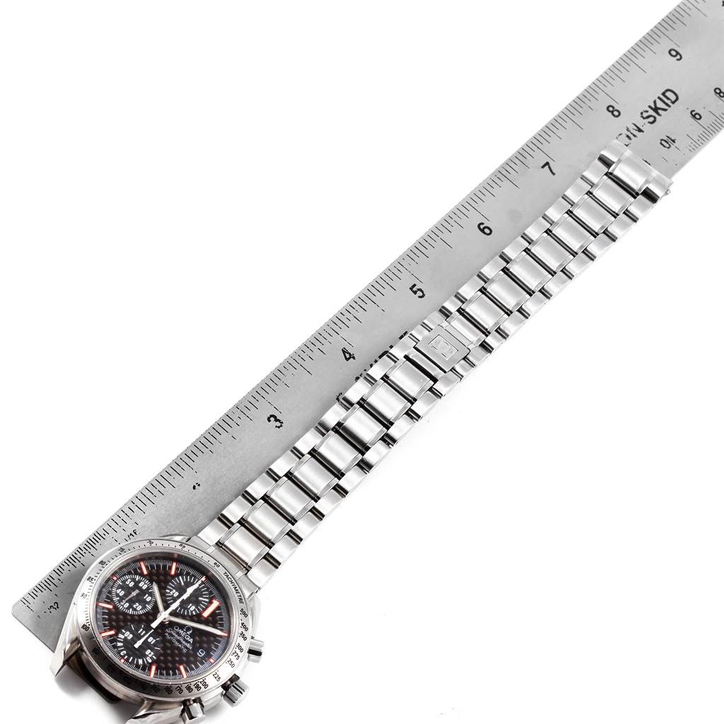 The Omega Speedmaster 3519.50.00 Men
s Stainless Steel Black Dial 3519.50.00 Men
s Stainless Steel Black Dial watch is shown angled diagonally with its bracelet being measured by a ruler.