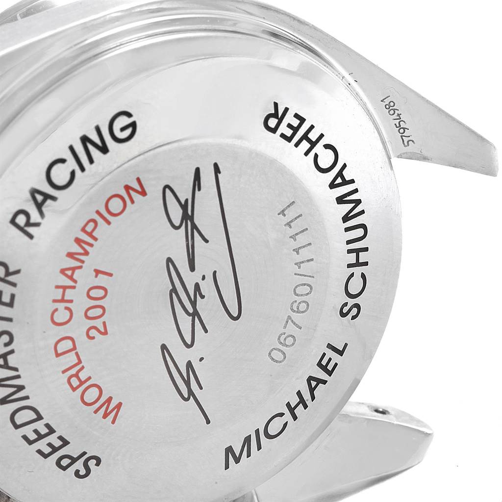 This image shows the case back of an Omega Speedmaster 3519.50.00 Men
s Stainless Steel Black Dial 3519.50.00 Men
s Stainless Steel Black Dial Racing watch, viewed at an oblique angle highlighting the engravings.