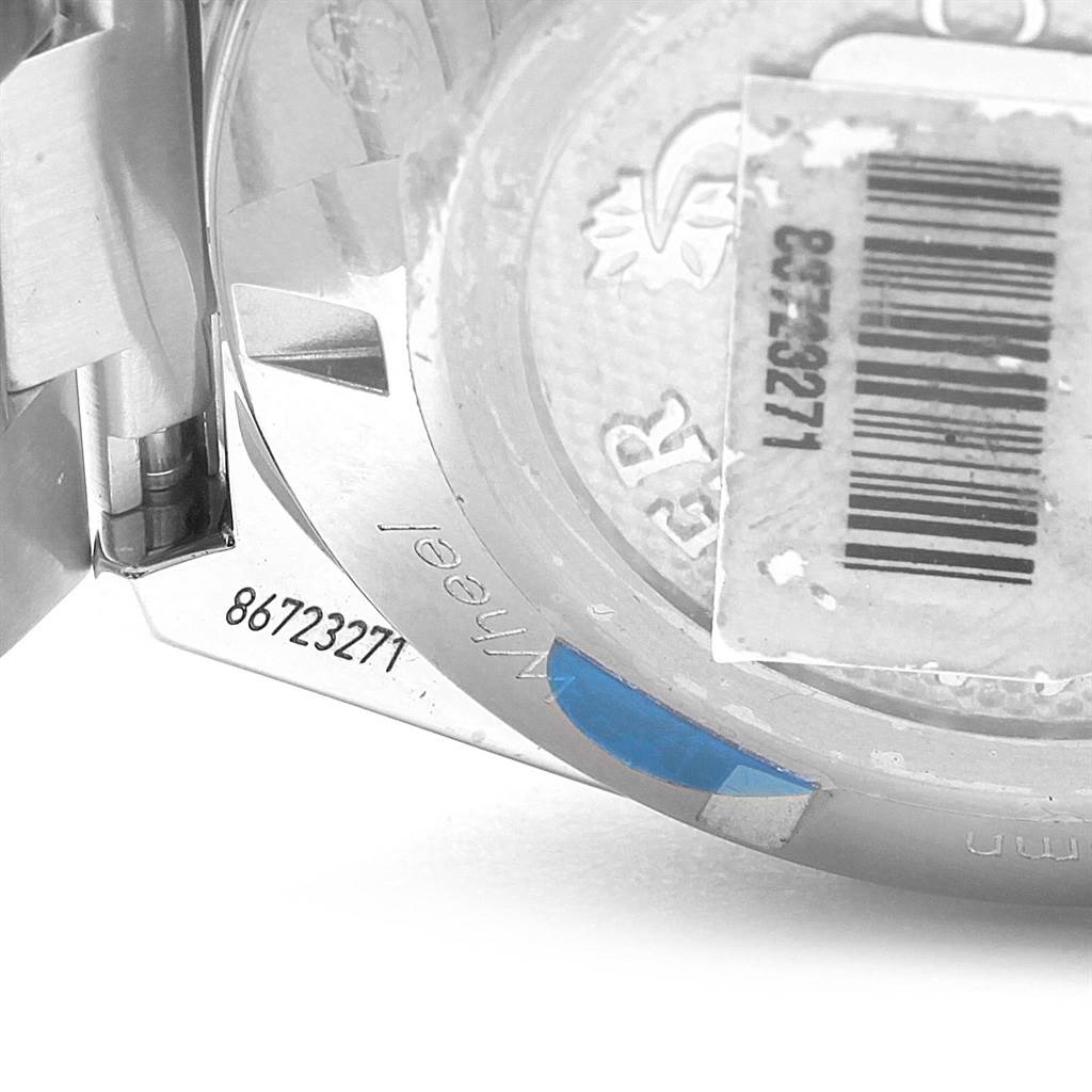 The image shows the back of an Omega Speedmaster 327.10.43.50.06.001 Men
s Stainless Steel Grey Dial 327.10.43.50.06.001 Men
s Stainless Steel Grey Dial, highlighting the case back with a visible serial number and bar code sticker.