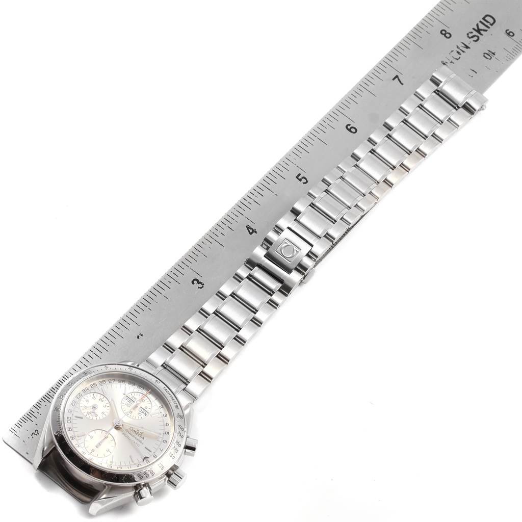 This image shows an Omega Speedmaster 3523.30.00 Men
s Stainless Steel Silver Dial 3523.30.00 Men
s Stainless Steel Silver Dial watch laid flat, with a ruler displaying its metal bracelet length.