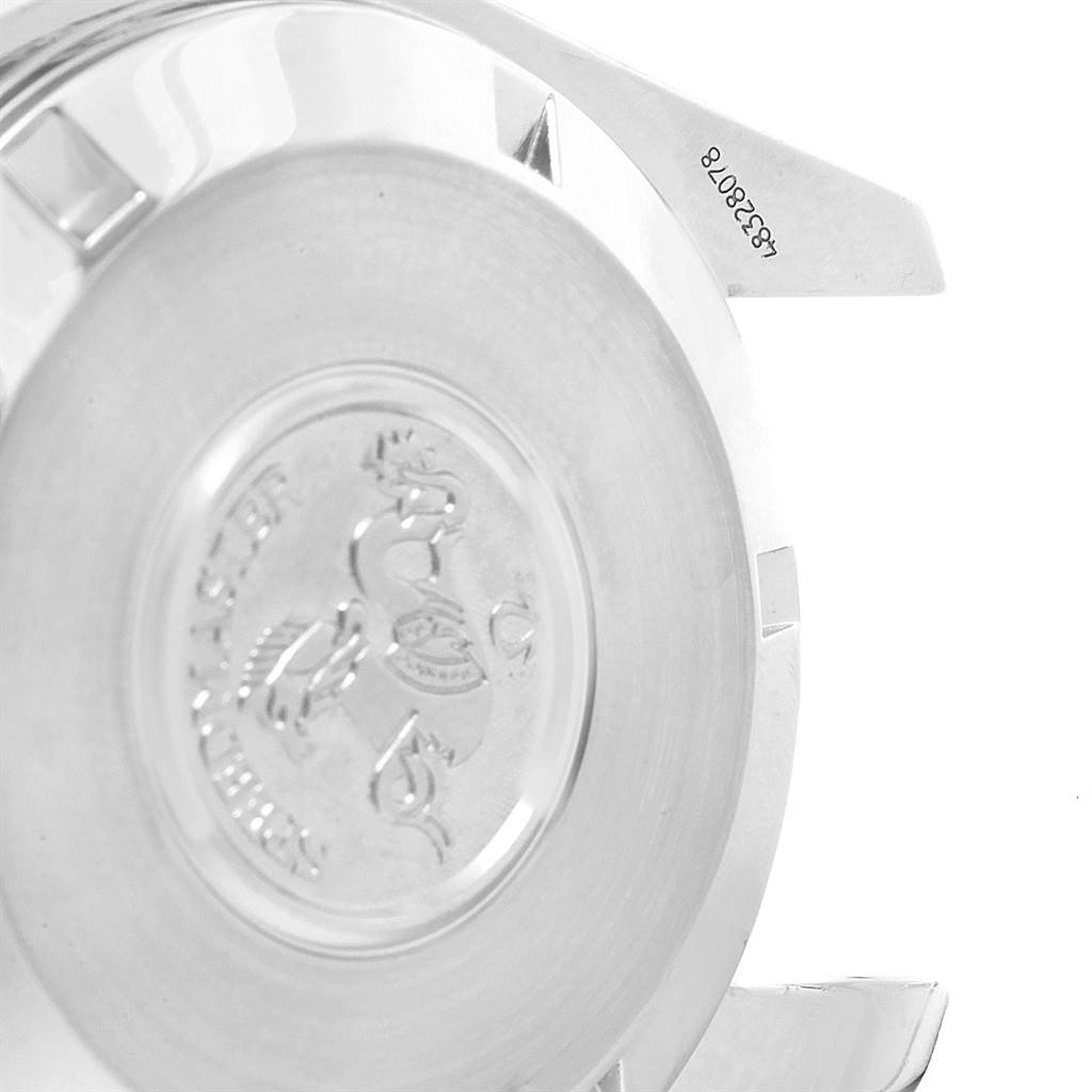 This image shows the case back of an Omega Speedmaster 3594.50.00 Men
s Stainless Steel Black Dial 3594.50.00 Men
s Stainless Steel Black Dial watch, showcasing the emblem and serial number.