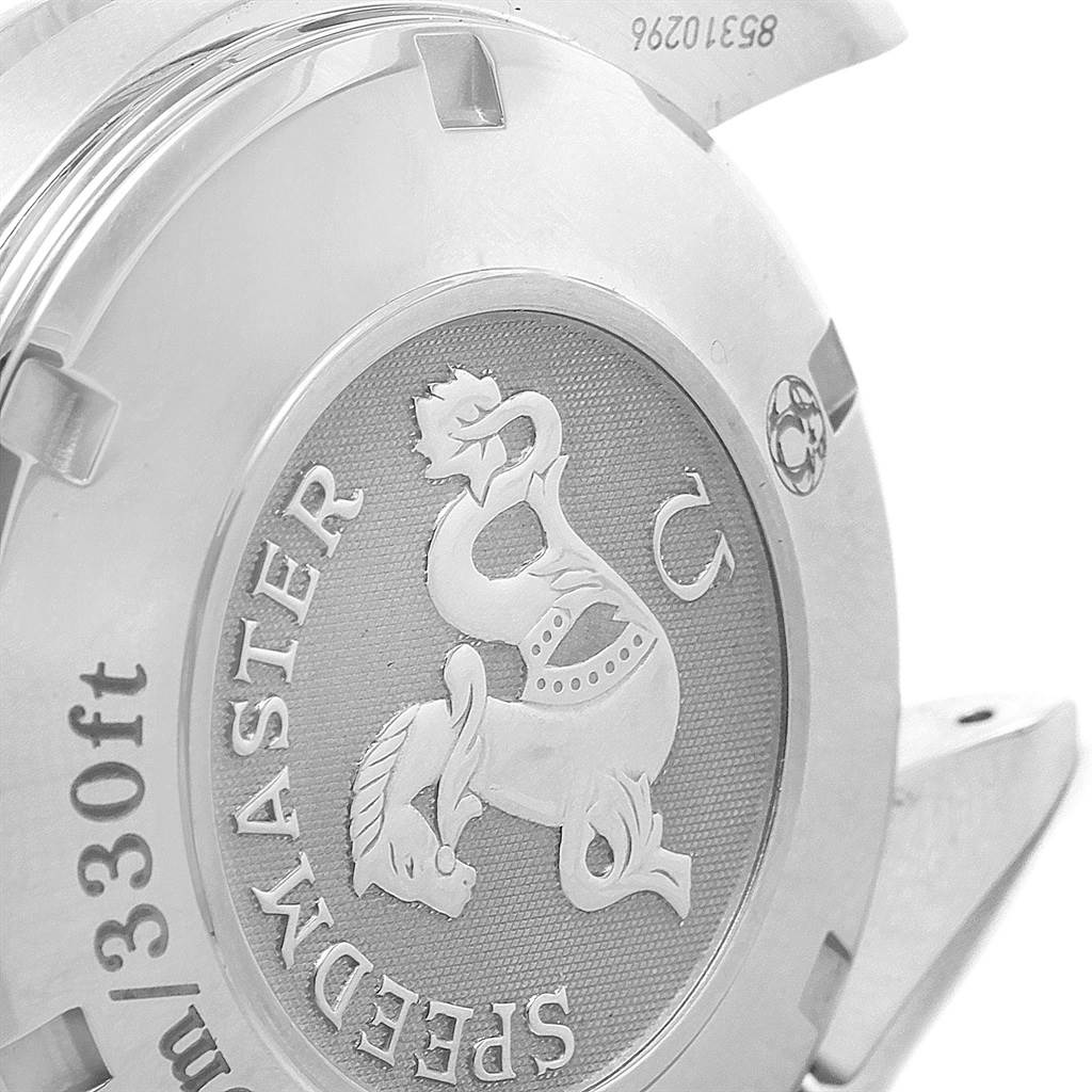 The image shows a close-up of the case back of an Omega Speedmaster 323.30.40.40.06.001 Men
s Stainless Steel Grey Dial 323.30.40.40.06.001 Men
s Stainless Steel Grey Dial watch focusing on its engraved logo and text.