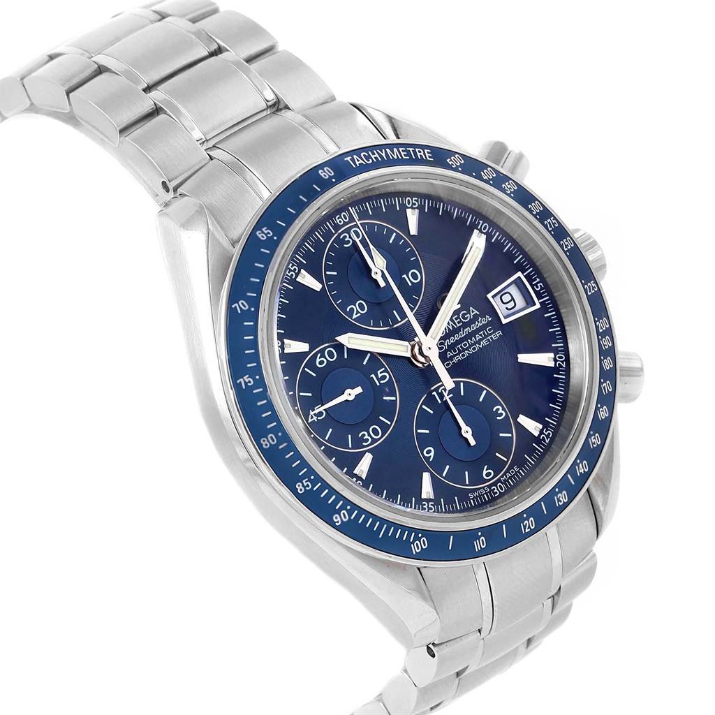 The image shows an angled view of an Omega Speedmaster 3212.80.00 Men
s Stainless Steel Blue Dial 3212.80.00 Men
s Stainless Steel Blue Dial watch, highlighting the dial, tachymeter bezel, and metal bracelet.